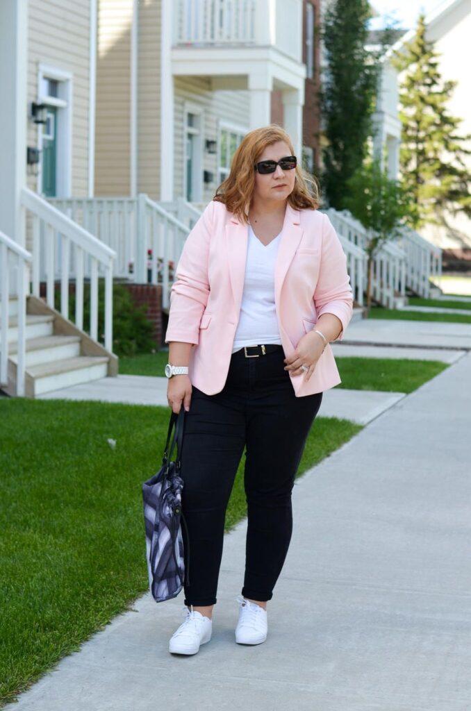 Pink blazer and black trousers
