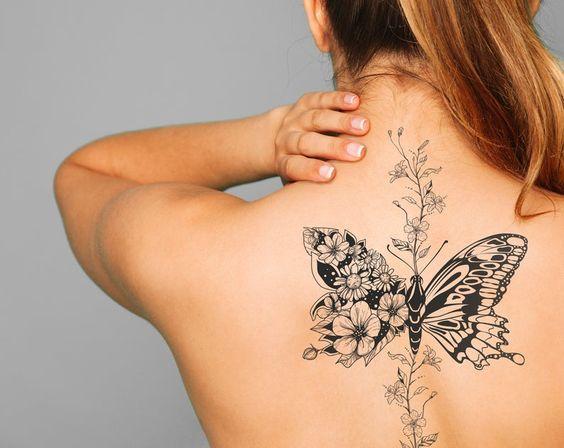 Butterfly feminine tattoo