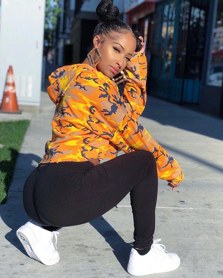 Cute black baddie in a colorful cropped sweater and white sneakers