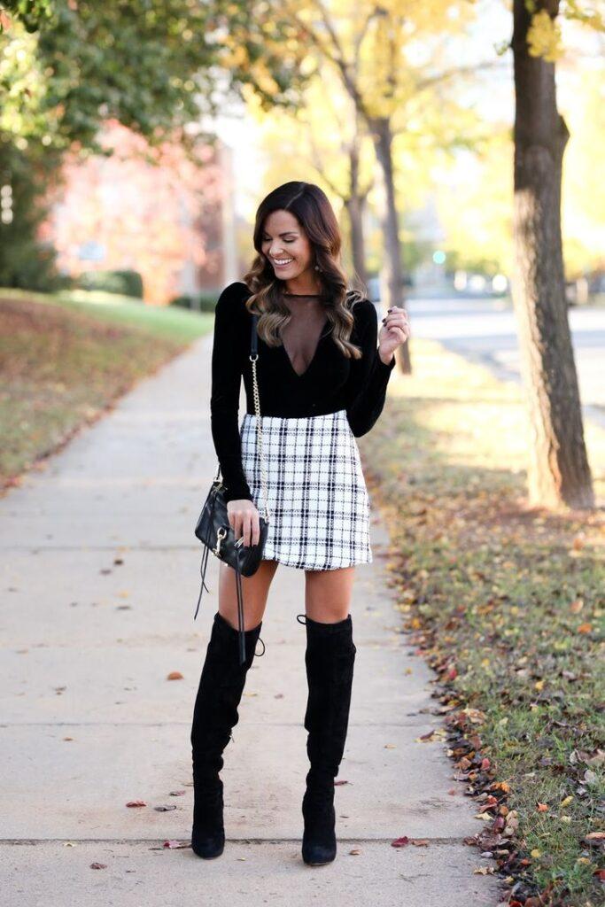 Knee-high boots and plaid skirt