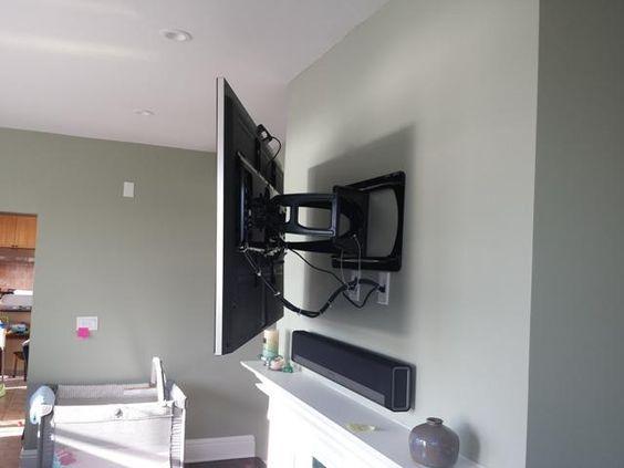 Metal Mounted TV above a Fireplace