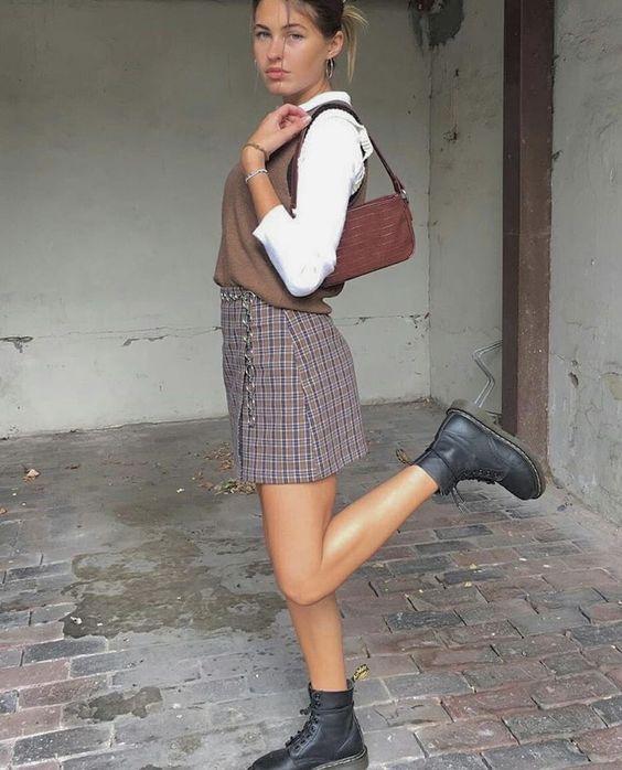 Sweater vest and plaid skirt