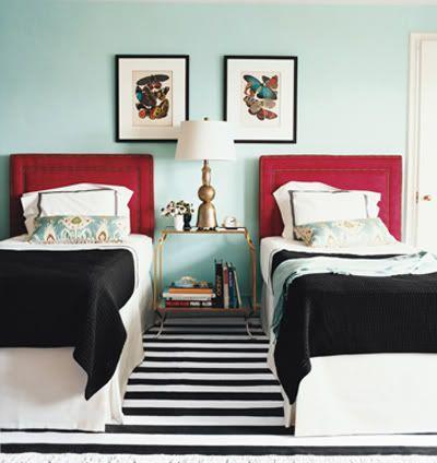 Two beds with similar wall art