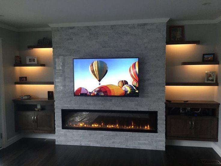 Long fireplace with a TV above