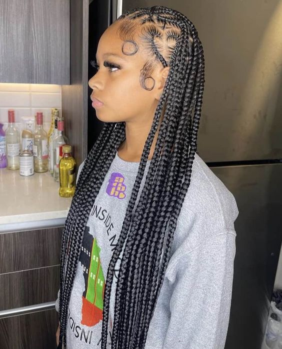 long Cornrows with a heart shape