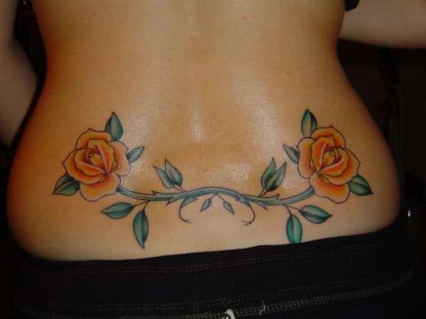 Floral lower back tattoos