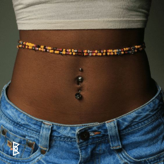 Girl with Waist Beads above bellybutton
